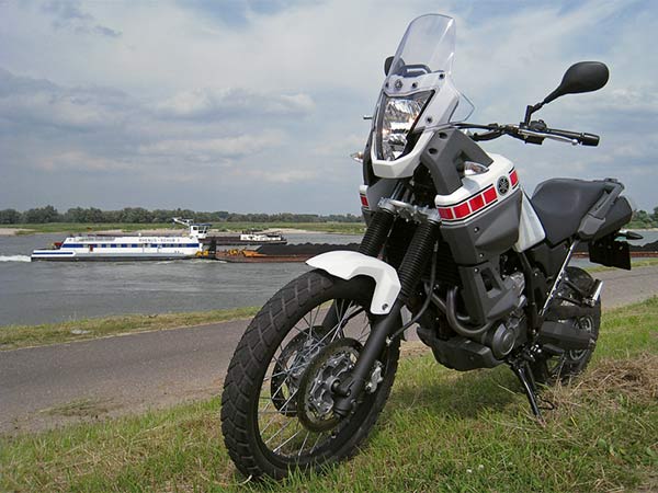 Yamaha Tenere with a boat in the background